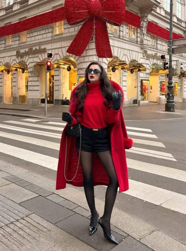23 Red Fur Trimmed Coat Red Turtleneck Black Shorts and Tights red fur trimmed coat layered with tights for standout switzerland winter outfits in snow
