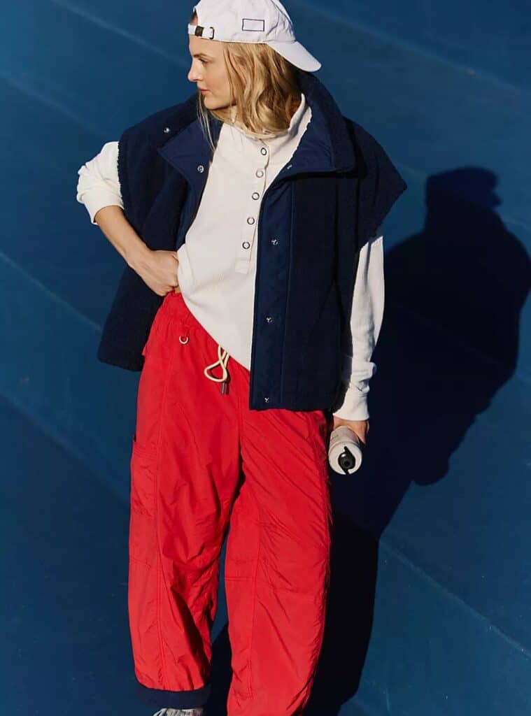 28 Navy Sherpa Vest Cream Henley Base Layer Red Technical Joggers navy sherpa vest layered over a cream henley base layer with red technical joggers a warm and casual winter hiking outfit