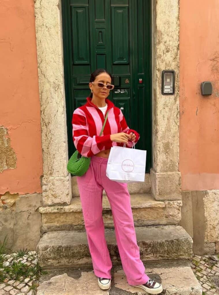 28 Red Striped Quarter Zip Pink Linen Trousers Canvas Sneakers casual winter styling in spain featuring a red striped quarter-zip styled with pink linen trousers and canvas sneakers