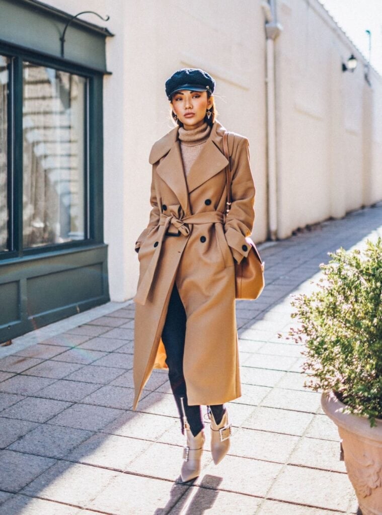 29 Camel Wrap Coat Beige Turtleneck Buckled Ankle Boots timeless winter outfits for spain styled with a camel wrap coat layered over a beige turtleneck and buckled ankle boots
