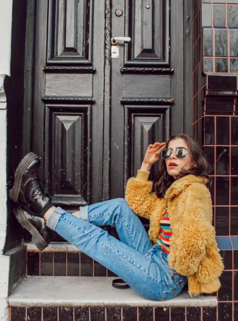 3 Faux Fur Coat Striped Knit Top Rolled Denim Jeans Black Platform Boots trendy winter looks styled with a faux fur coat, striped knit top, rolled denim jeans, and black platform boots