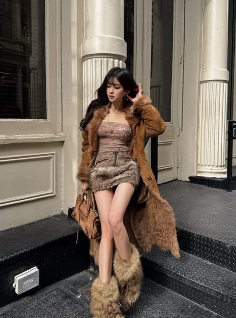 31 Chocolate Shearling Trimmed Coat Earthy Suede Mini Skirt Faux Fur Boots shearling coat and suede mini skirt styled for cold weather vegas winter outfits