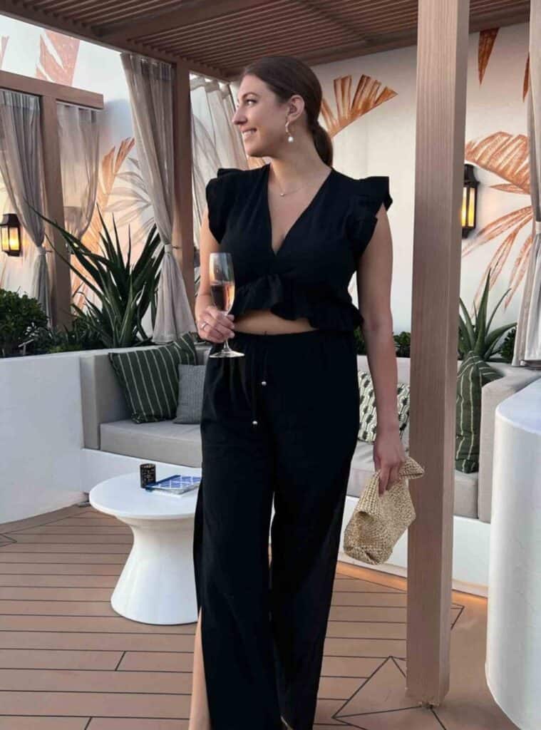 5 Black Ruffle Sleeve Top Wide Leg Trousers Straw Clutch Bag black ruffle sleeve top wide leg trousers straw clutch cruise style