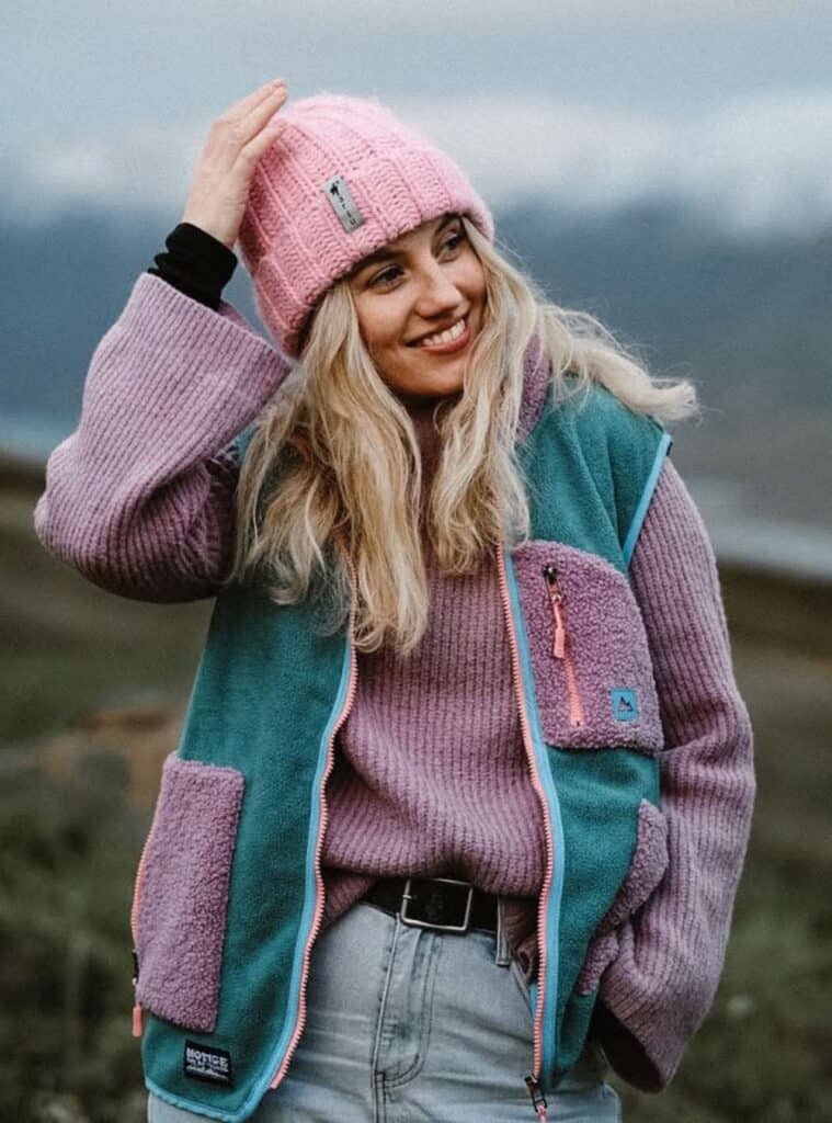 5 Lavender Ribbed Sweater Teal Purple Fleece Vest Light Wash Denim lavender ribbed sweater with a teal and purple fleece vest and light wash denim a relaxed take on hiking in winter outfits