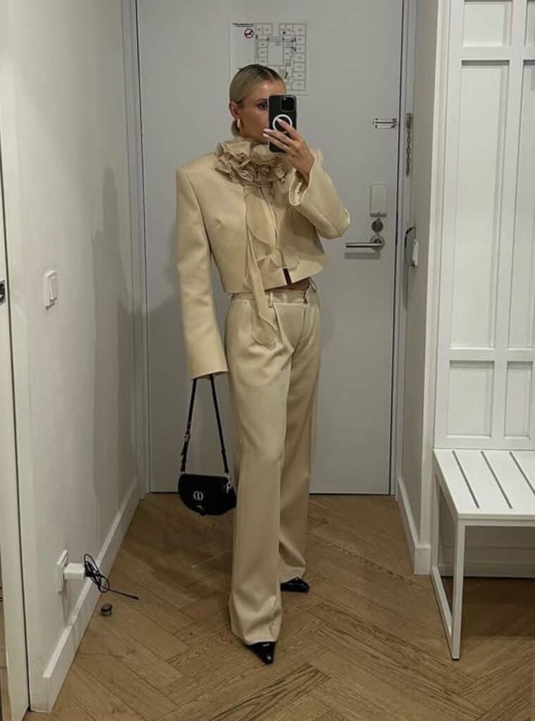 7 Cream Cropped Blazer Ruffled Blouse Matching Wide Leg Trousers cream cropped blazer ruffled blouse wide leg trousers polished cruise look