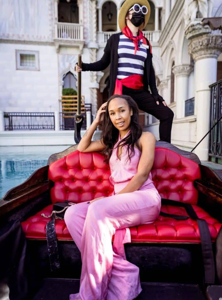 7 Pink Halter Wide Leg Jumpsuit White Toe Pointed Heels Black Crossbody Bag pink halter jumpsuit styled for vegas winter outfits with chic statement heels