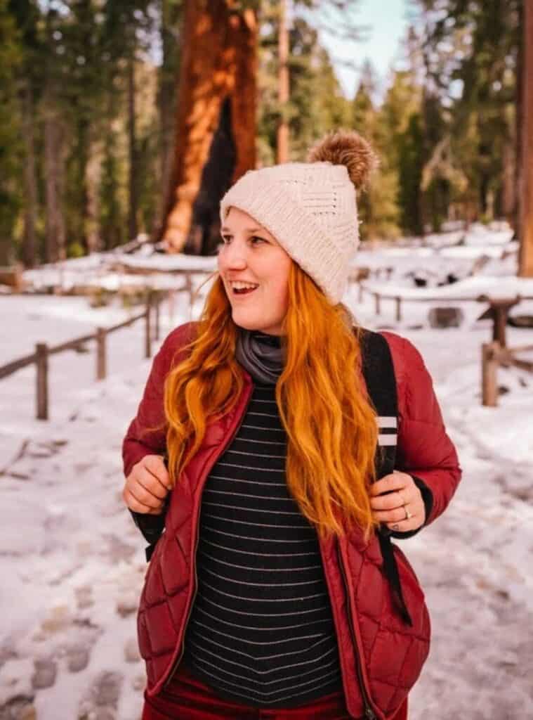 8 Quilted Puffer Jacket Monochrome Striped Sweater Outdoor Trousers quilted puffer jacket layered over a monochrome striped sweater with outdoor trousers a cozy and practical winter hiking outfit for women suitable for cold trail days